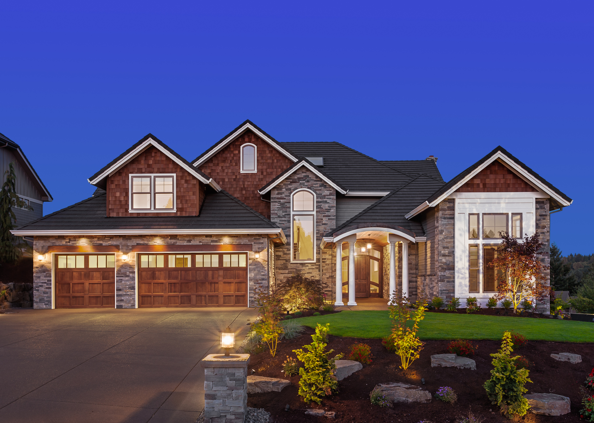 Front elevation of luxury home in evening